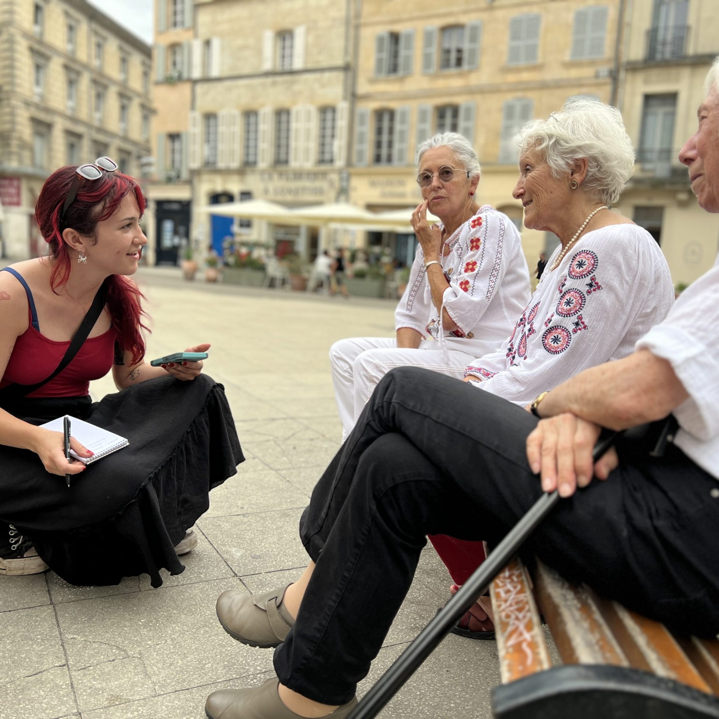 A student, Alexie Zollinger, interviews singers after their performance at FÃªte de la Musique, the annual World Music Day celebration. Photo: Deni Chamberlin